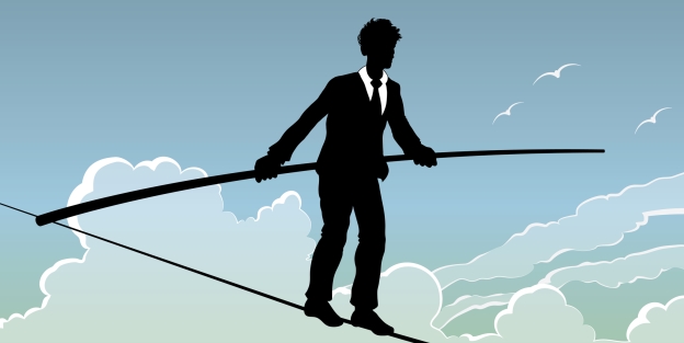 Clipart of man in business suit balancing on tightrope