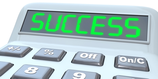 Calculator with the word success written in the digital screen