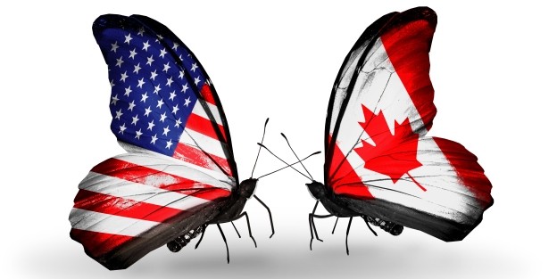 Butterfly with american flag facing a butterfly with Canadian flag