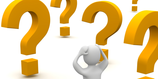 Clipart of confused person staring at large question marks