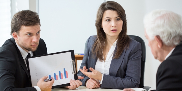 Employees showing boss chart on monitor