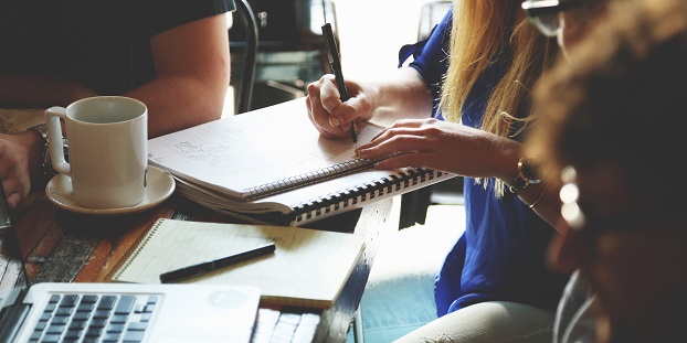 Business people gathered around desk
