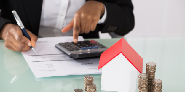Concept photo with man pressing button on calculator and filling principal residence form