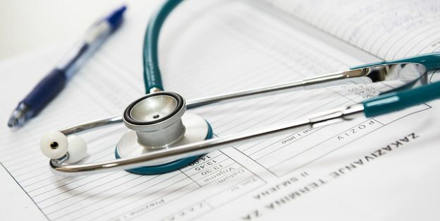 Stethoscope on doctors notebook