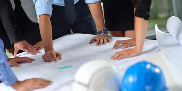 Construction workers Reviewing Plans