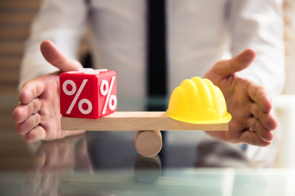 Hand Protecting Balance Between Percentage And Yellow Hardhat